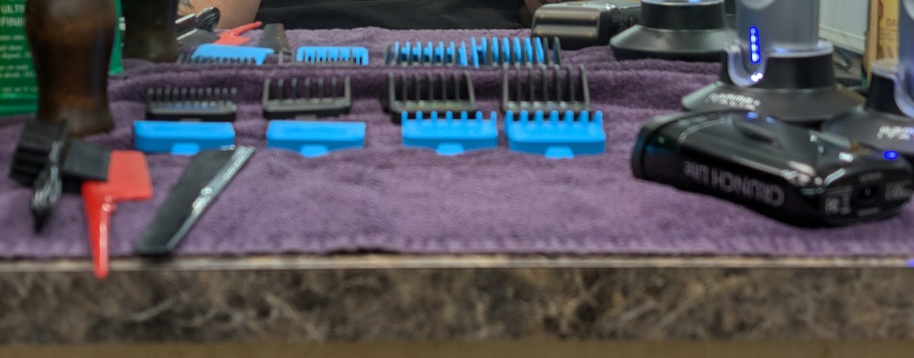 Harvey's guard combs, brushes, razor and clippers laid out on his station